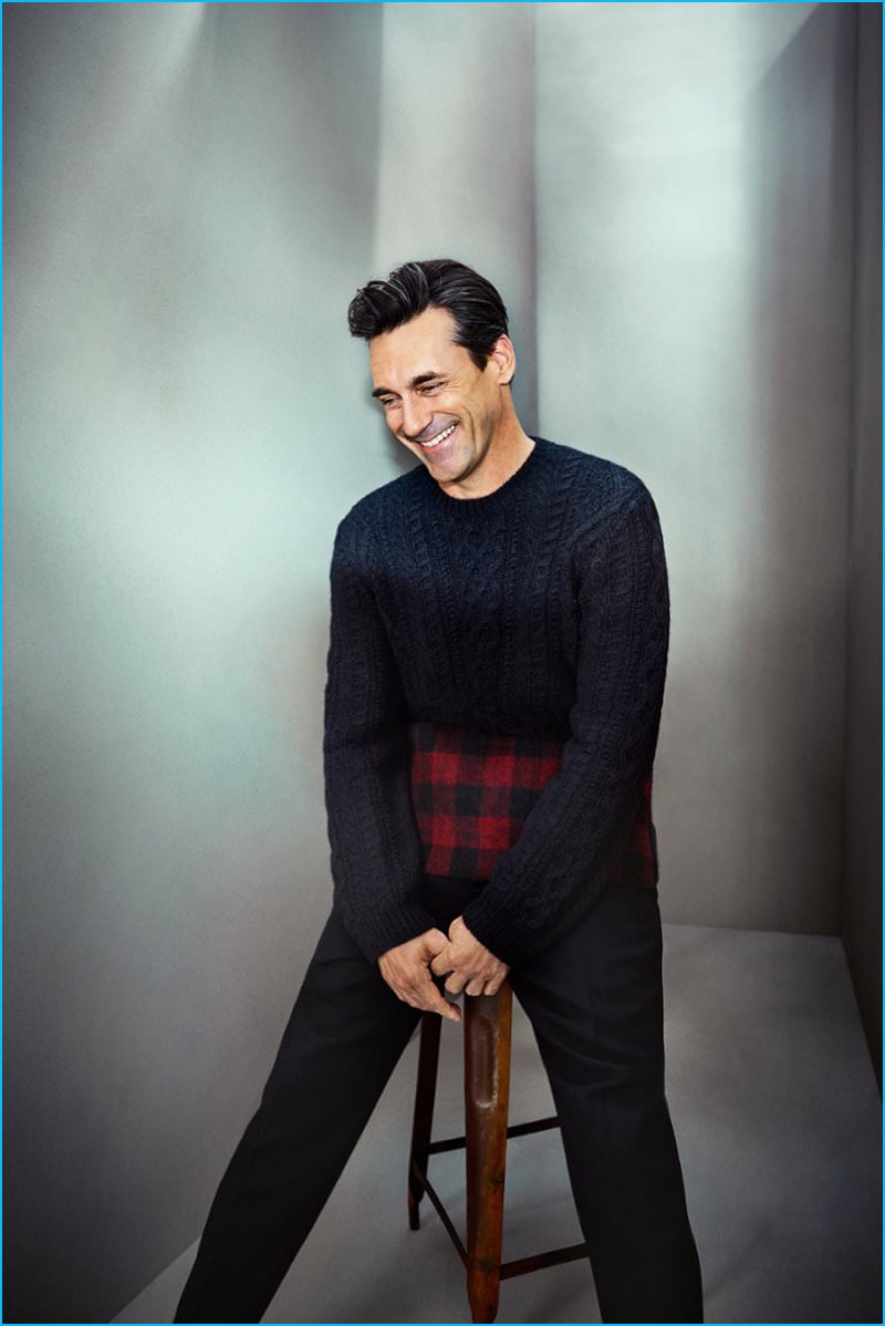 Appearing in a photo shoot for Mr Porter's The Journal, Jon Hamm dons a Valentino check paneled cable-knit wool and alpaca-blend sweater with Berluti tapered pleated wool trousers.