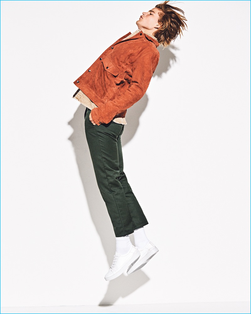 Autumnal tones are front and center as Jordan Barrett wears a red suede Topman jacket. The Australian model also rocks a Levi's t-shirt, Carhartt chinos, and Axel Arigato sneakers.