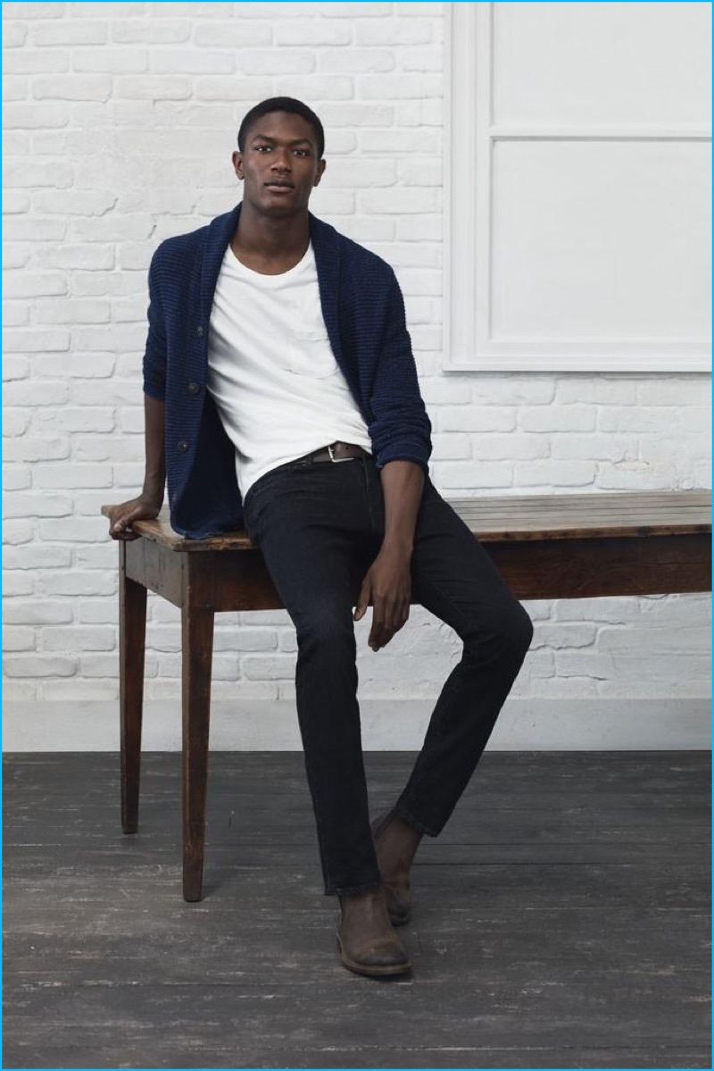 Wearing a look from Lucky Brand, Hamid Onifade is an easy vision in shawl neck cardigan sweater, pocket tee, skinny denim jeans, and leather ankle boots.