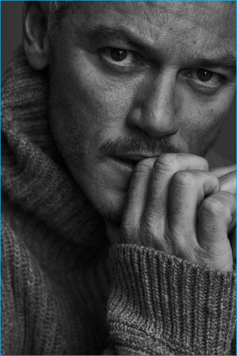 Appearing in a black & white image for Mr Porter's The Journal, Luke Evans dons a ribbed wool turtleneck sweater from Acne Studios.