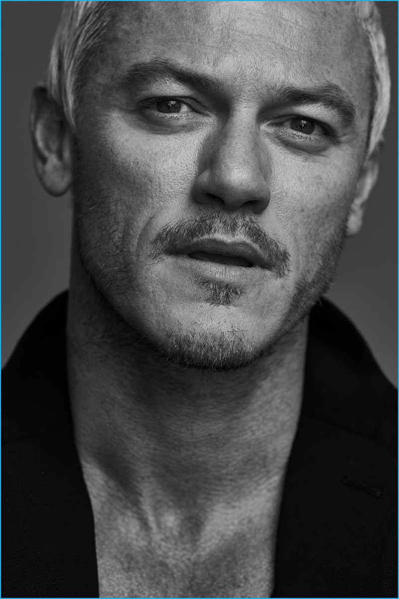 Front and center, Luke Evans wears a wool and cashmere coat from Acne Studios.