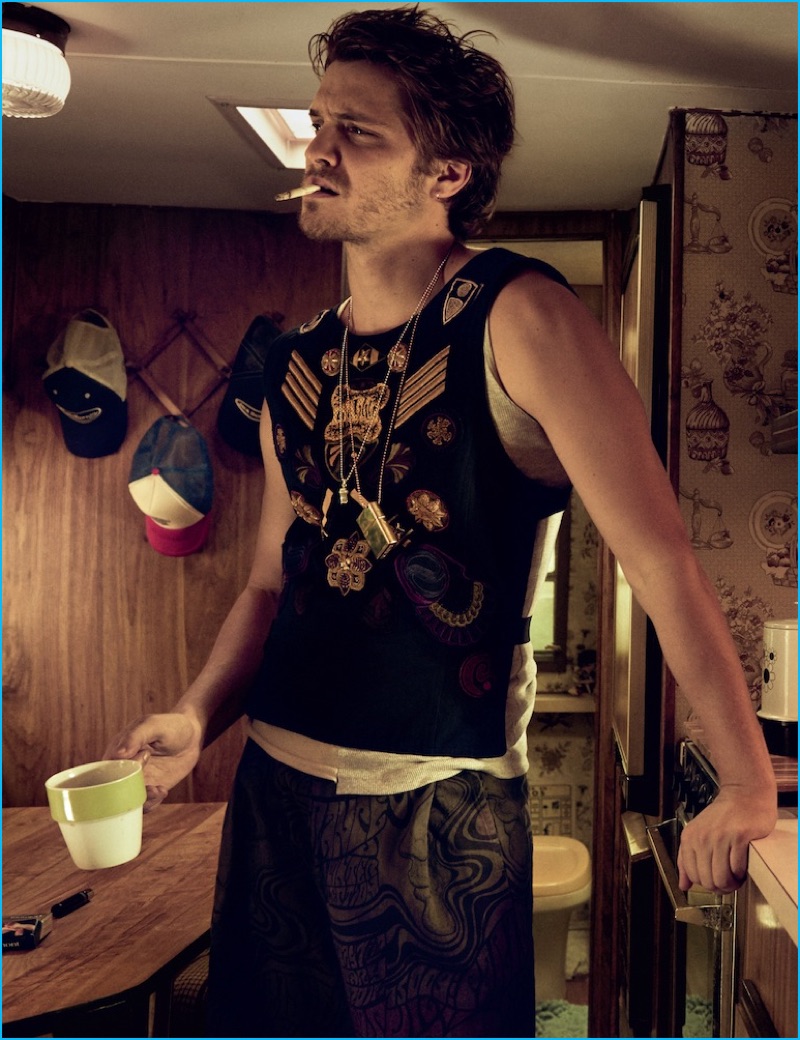Embracing trailer life, Luke Grimes wears a decadent tank and shorts from Dries Van Noten for Interview magazine.