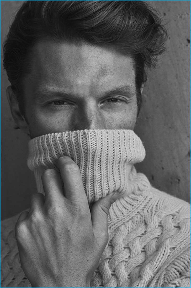 South African model Shaun DeWet dons a cable-knit turtleneck sweater from Massimo Dutti.