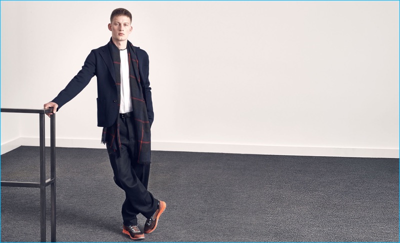 Bastian Thiery models an Orley single-breasted wool blazer with a Balenciaga shirt, Ami wool trousers, Lanvin trousers, and a Begg & Co. checked cashmere scarf from Matches Fashion.