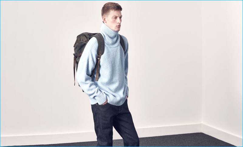 Dressing for fall, Bastian Thiery sports an oversized turtleneck sweater from Ami with Jean Shop denim jeans and a Missoni utility backpack from Matches Fashion.