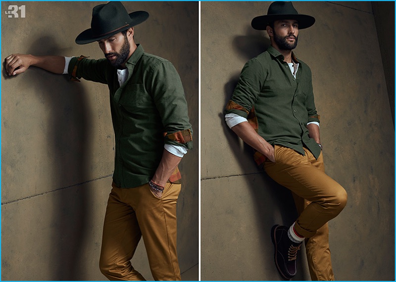 A rugged cool image, Noah Mills rocks a Brixton Mayfield hat with a waffled t-shirt, check back shirt, stretch chino pants, and work socks from LE 31.