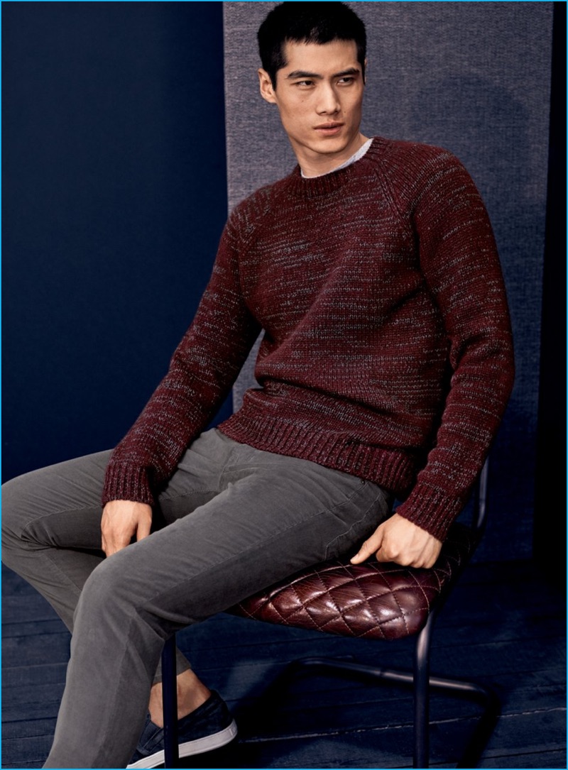 Hao Yun Xiang dons a marled sweater, corduroy pants, and slip-on sneakers from Vince.