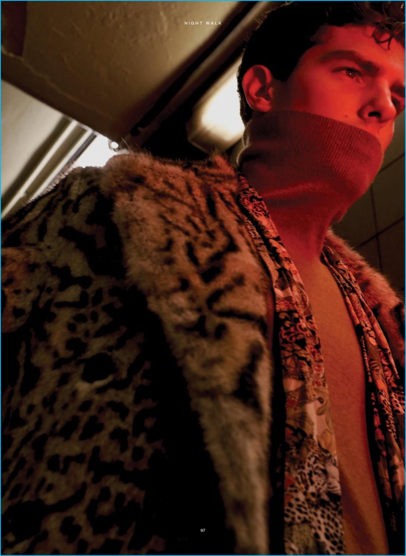 Embracing an opulent look for Iris Covet Book, Paolo Anchisi wears a leopard print fur coat and scarf from Roberto Cavalli with a Billy Reid turtleneck.