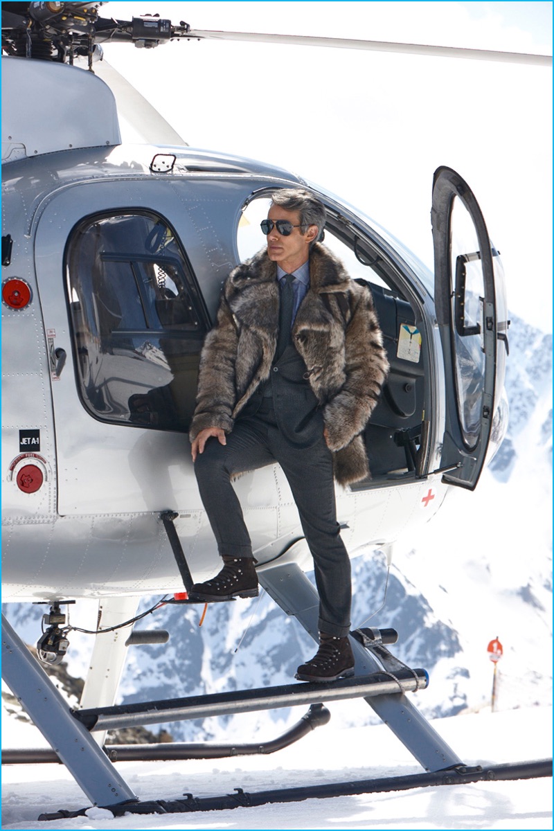 Andrew Lauren poses alongside a helicopter for Ralph Lauren Purple Label's fall-winter 2016 campaign.