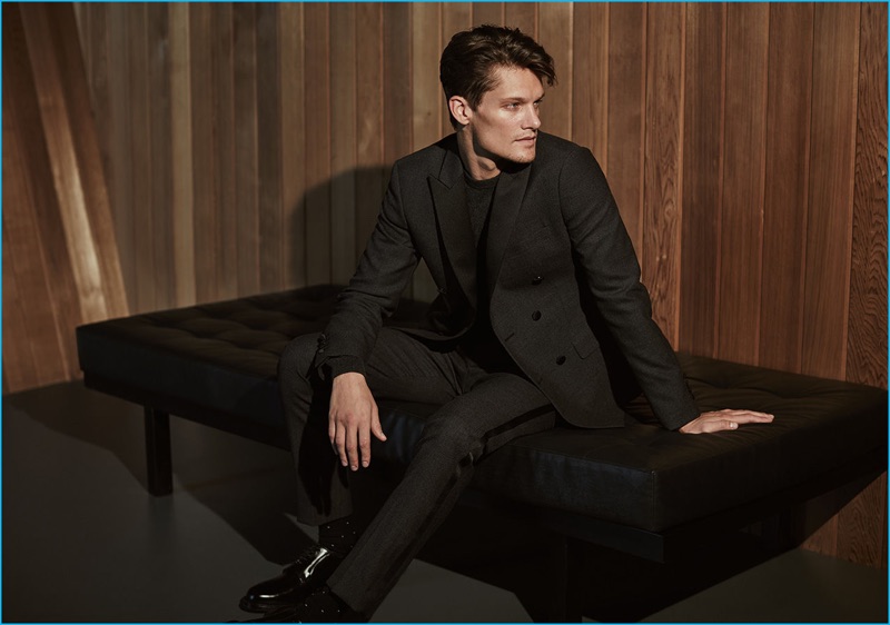 English model Danny Beauchamp dons a double-breasted tuxedo with a cashmere sweater from Reiss' fall-winter 2016 premium collection.