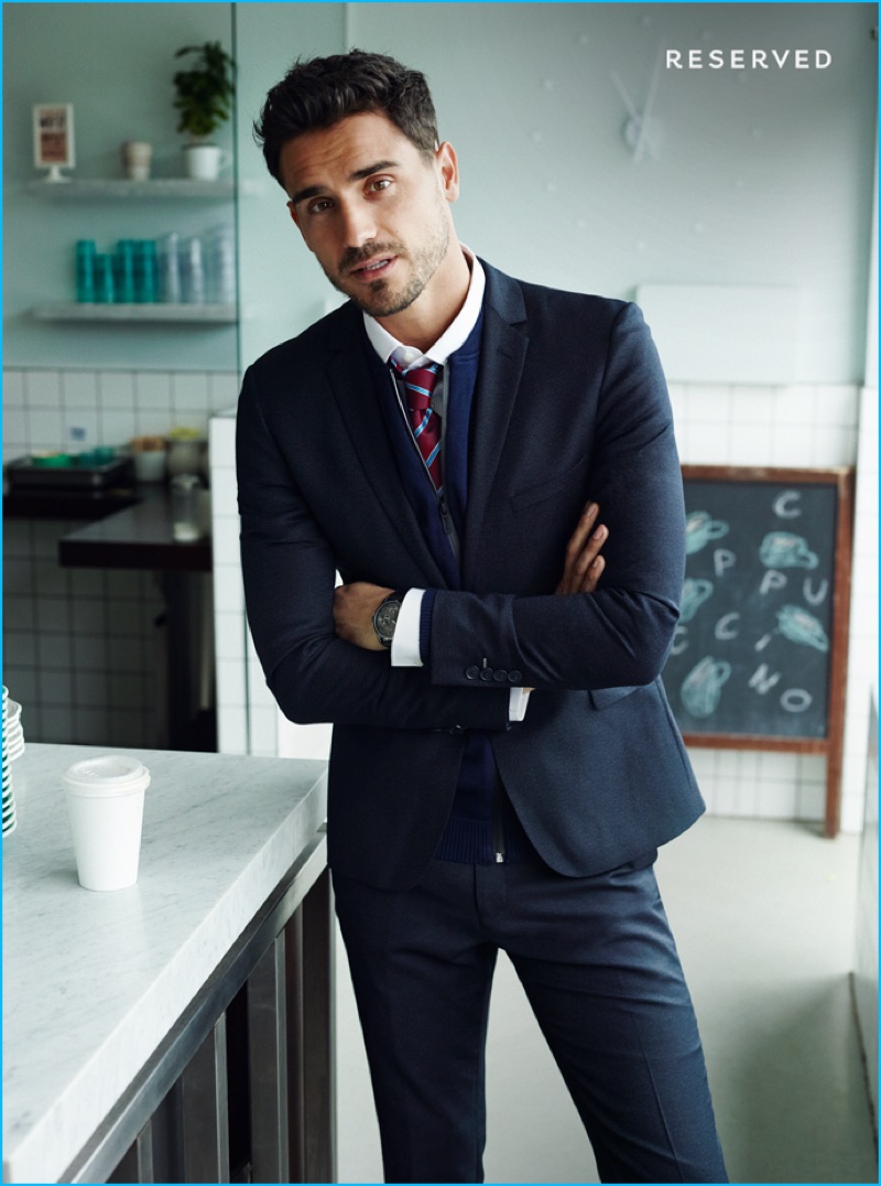 Arthur Kulkov dons a trim navy suit for Reserved's fall-winter 2016 advertising campaign.