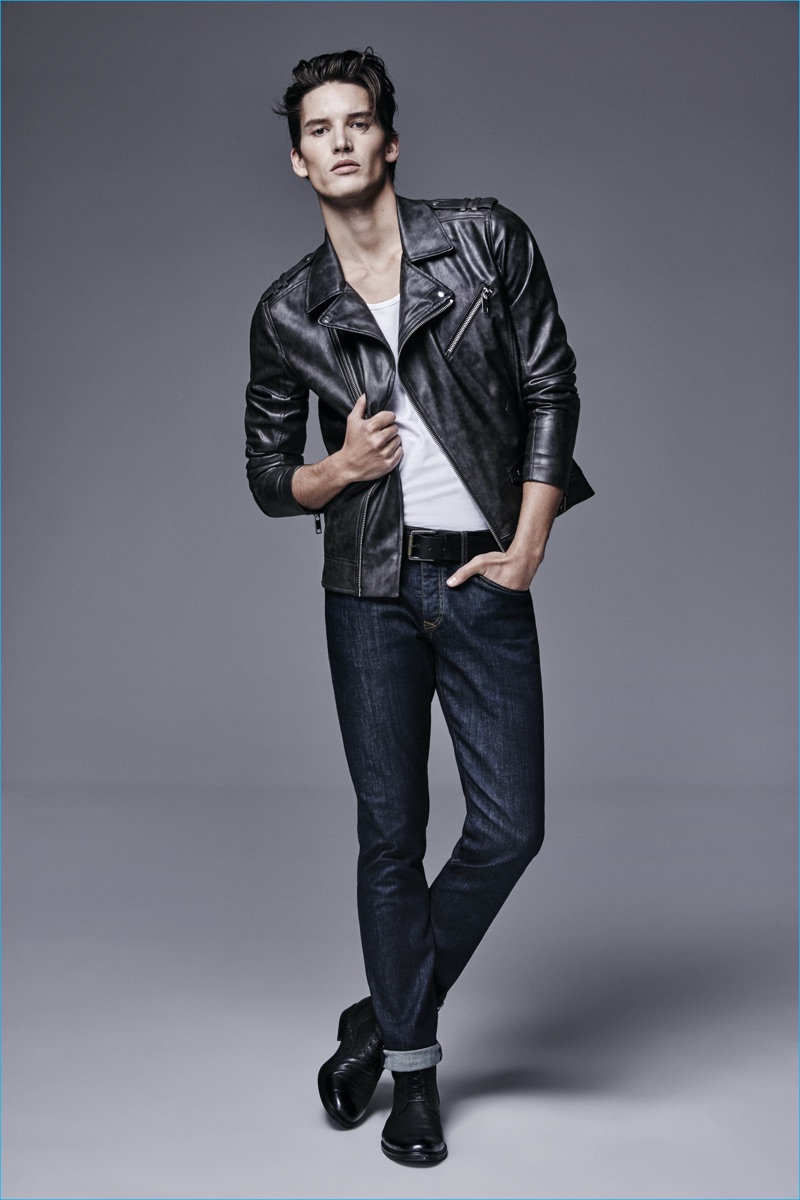 Dominik Bauer rocks a leather jacket with dark rinse denim jeans from River Island.