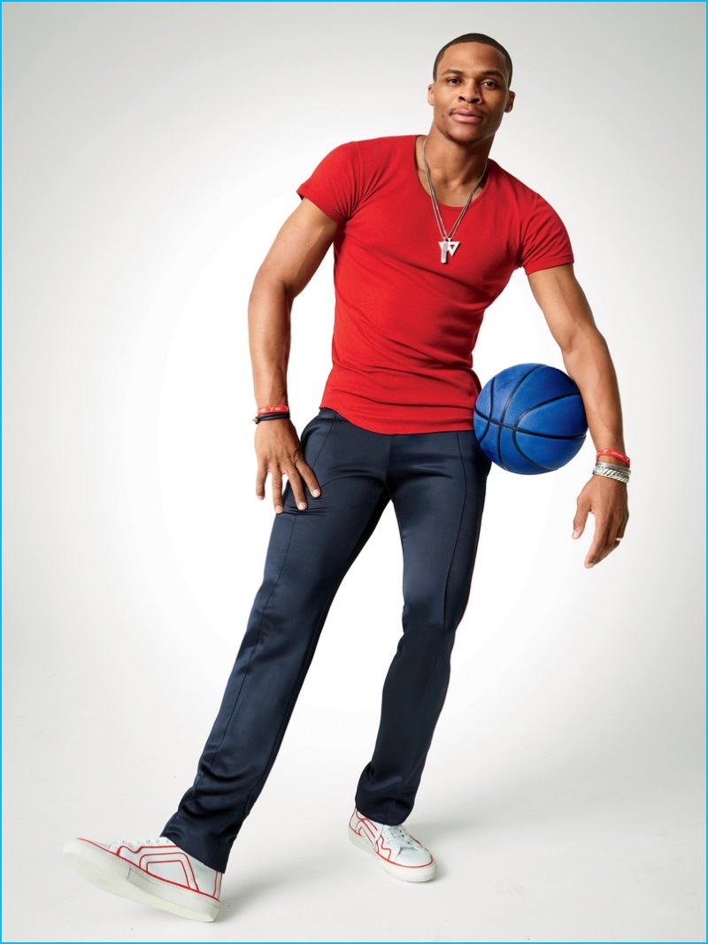 Standing tall at 6′ 3″, Russell Westbrook wears a red Balmain t-shirt with Burberry track pants, Pierre Hardy sneakers, and a Del Toro navy bracelet for GQ.