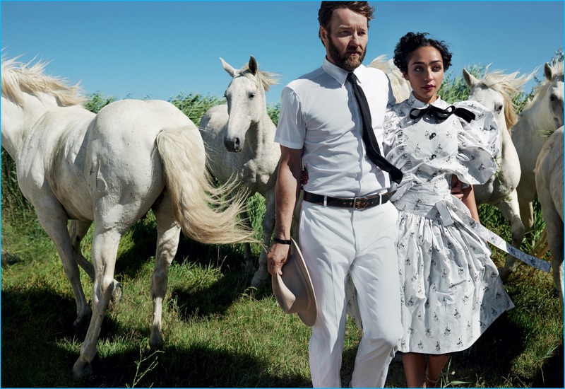 Donning white fashions, Loving co-stars Joel Edgerton and Ruth Negga pose with horses for Vogue.