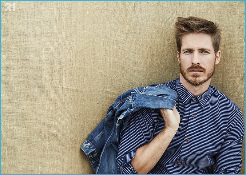 Going casual, Ryan Burns models a LE 31 horizon-stripe oxford shirt with a Levi's authentic jean jacket.