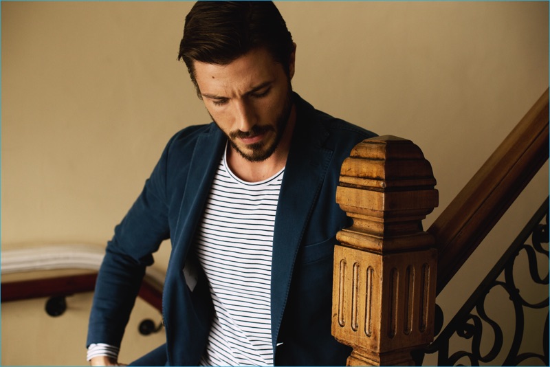 Model Ryan Douglas tackles casual smart style in a Boglioli blazer with a striped Club Monaco t-shirt.