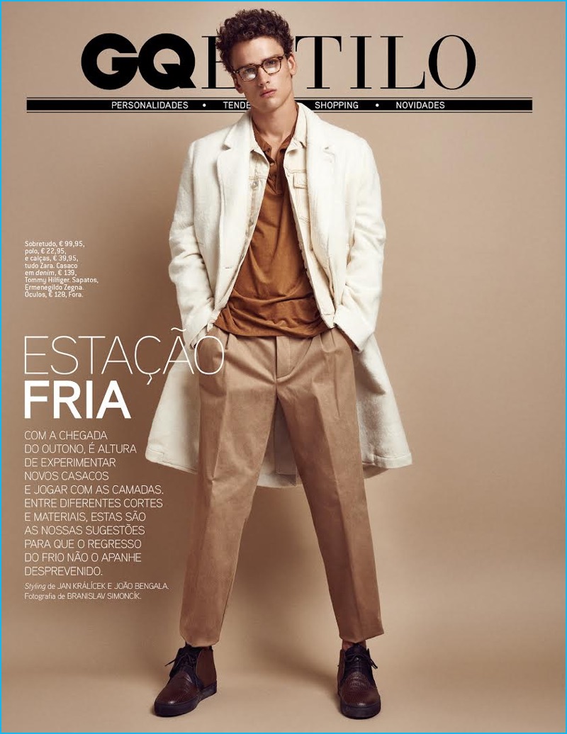 Simon Nessman models a white coat from Zara Man for GQ Portugal.