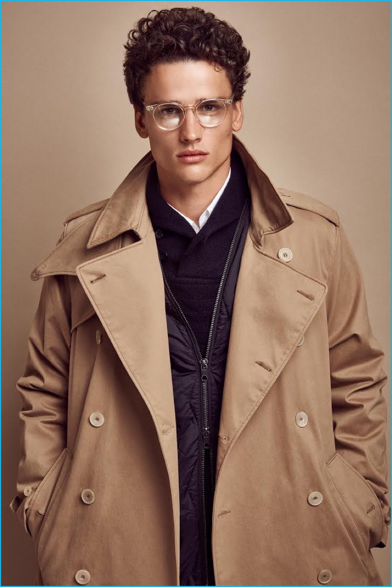 Going for a geek chic look, Simon Nessman rocks a Dockers trench coat for GQ Portugal.