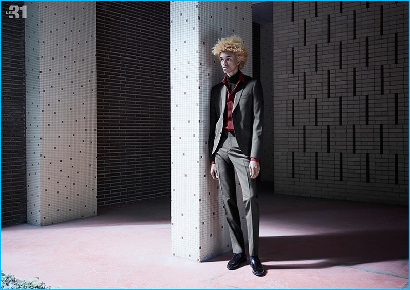 Michael Lockley embraces red and grey, wearing a micro-houndstooth suit and stretch shirt.