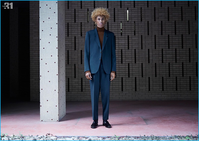 Suiting up in LE 31, Michael Lockley is striking in blue for Simons' Modern Retro lookbook.