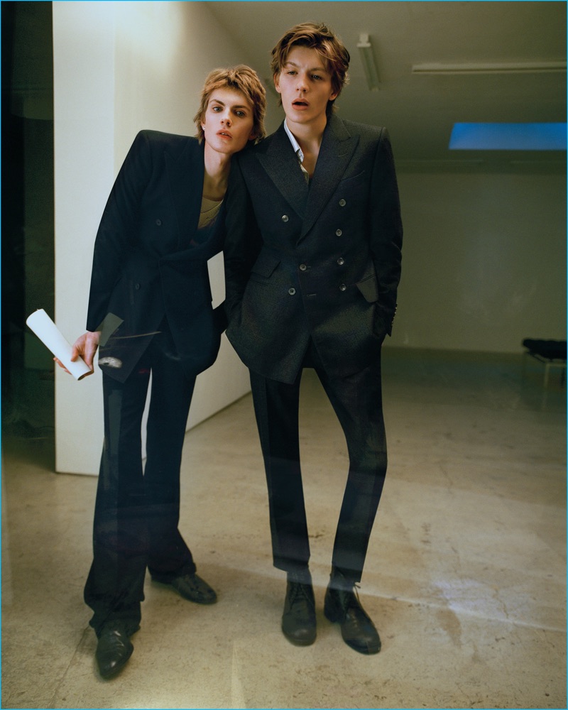 Pictured left, James Crewe wears a double-breasted Bottega Veneta jacket and pants with a vintage sweater and shoes. Meanwhile, Finnlay Davis dons a double-breasted Tom Ford suit with a vintage shirt.