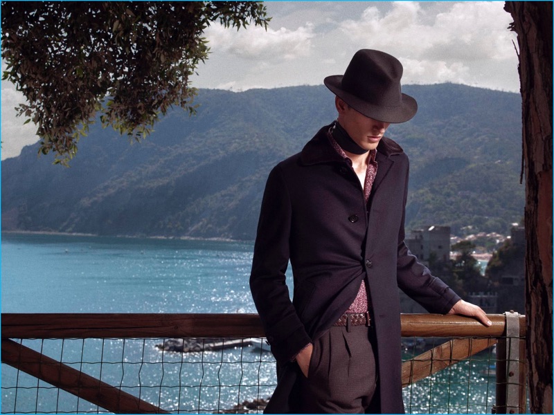 Embracing an air of mystery, Dominik Bauer wears a sleek look from Ermenegildo Zegna.