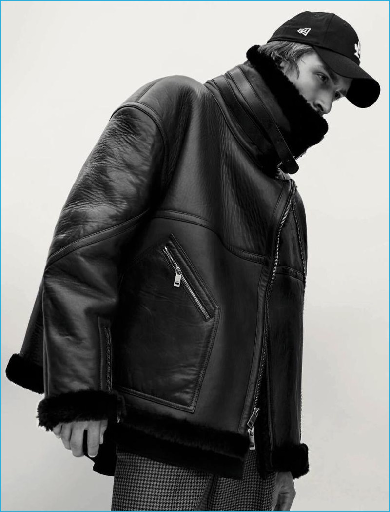 Tim Dibble models a leather jacket from Jil Sander with Kenzo houndstooth trousers and a New Era cap for L'Officiel Hommes Germany.