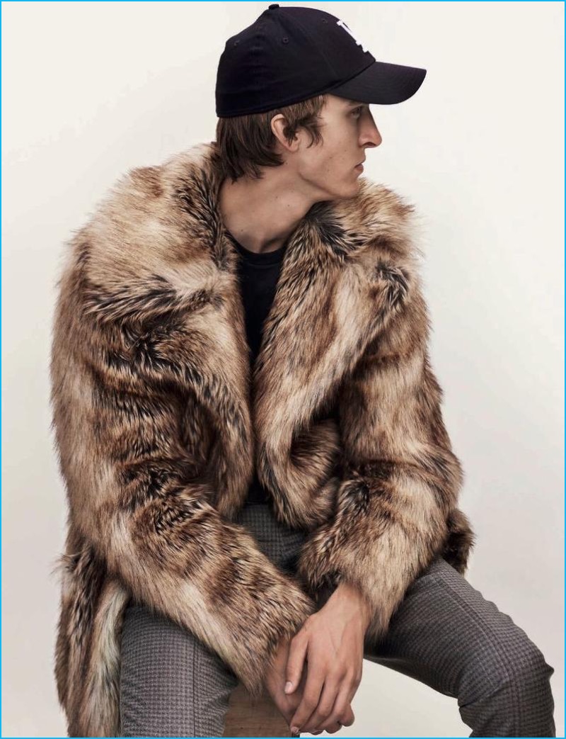 Tim Dibble wears a Dries Van Noten fur cap with 22/4 trousers and a New Era cap for L'Officiel Hommes Germany.
