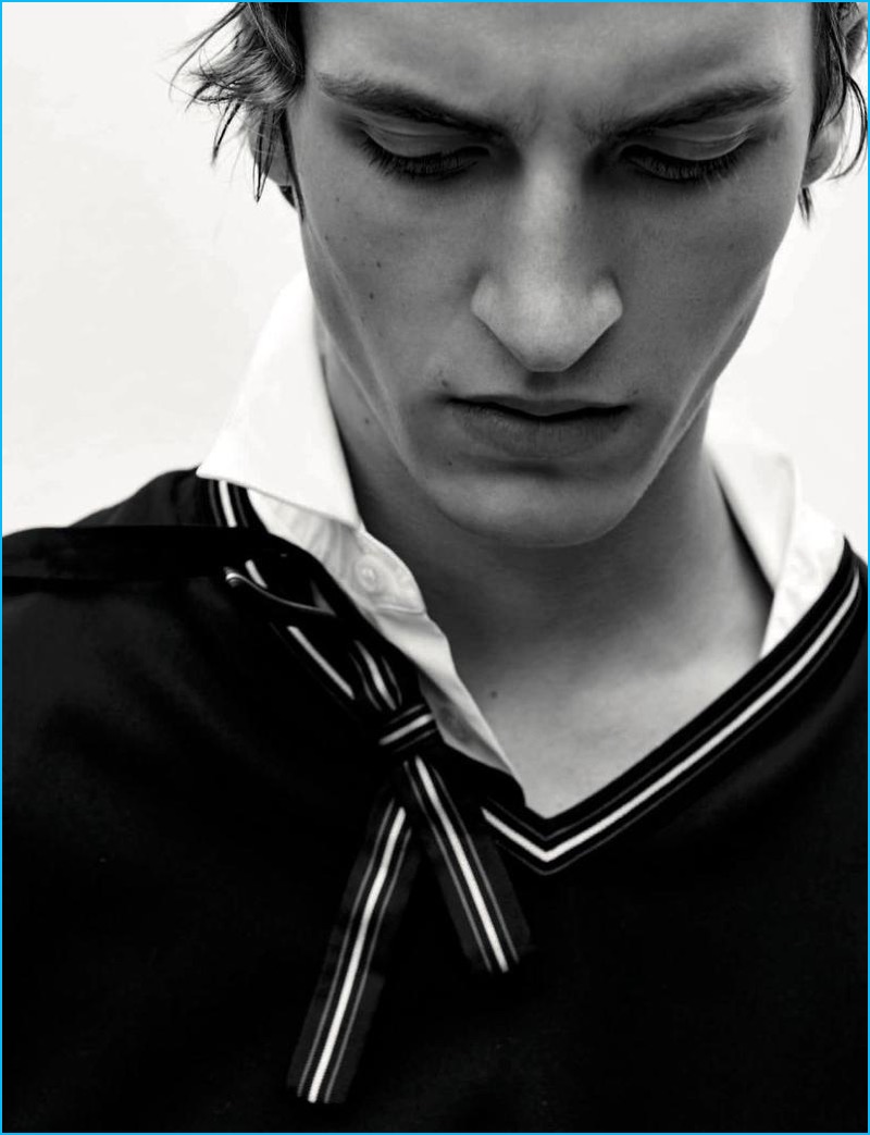 Tim Dibble models a v-neck sweater and polo from Dior Homme for L'Officiel Hommes Germany.