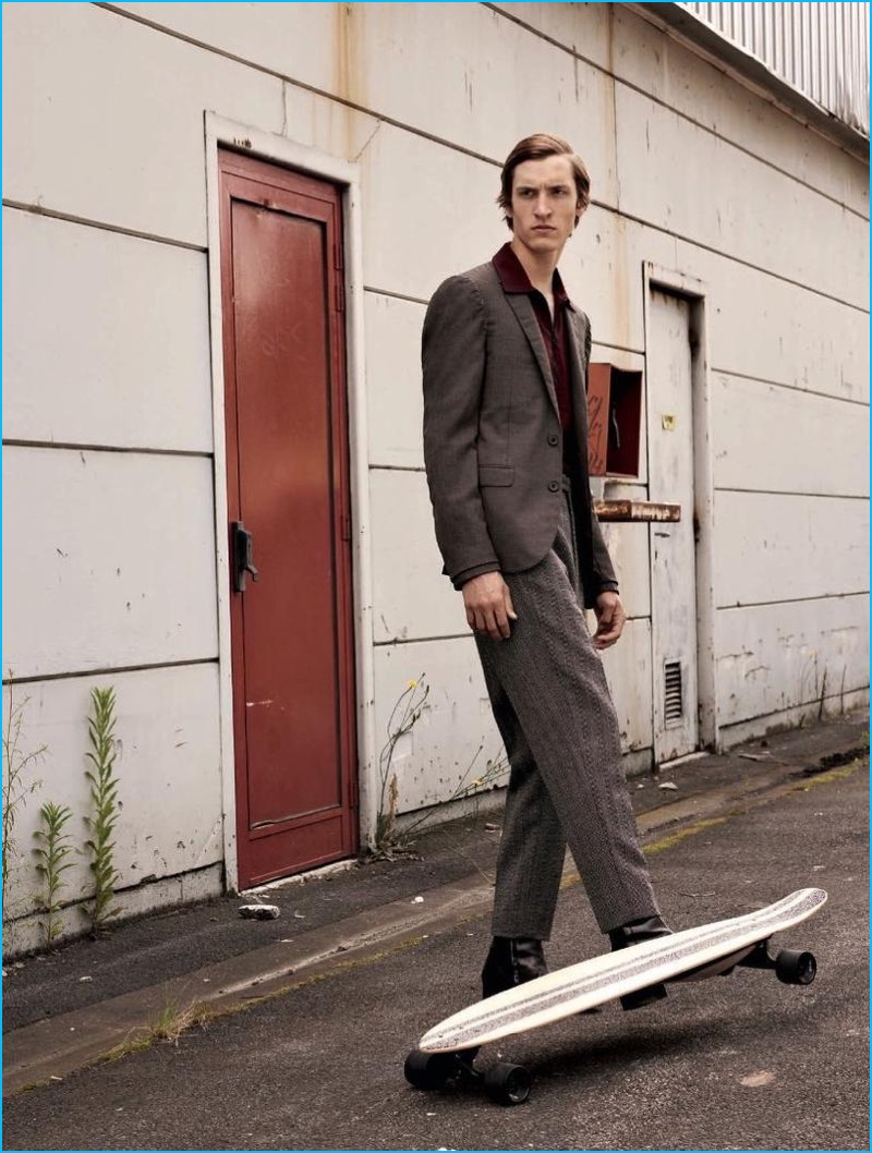 Tim Dibble dons a sport jacket, top, and trousers from Lanvin with Paul Smith leather boots for L'Officiel Hommes Germany.