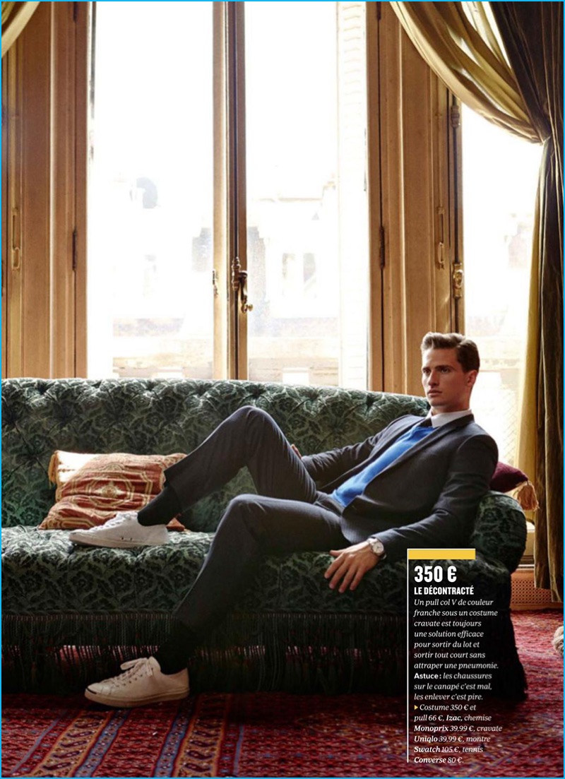 Tom Warren wears a suit and sweater from Izac with a Monoprix shirt for GQ France.