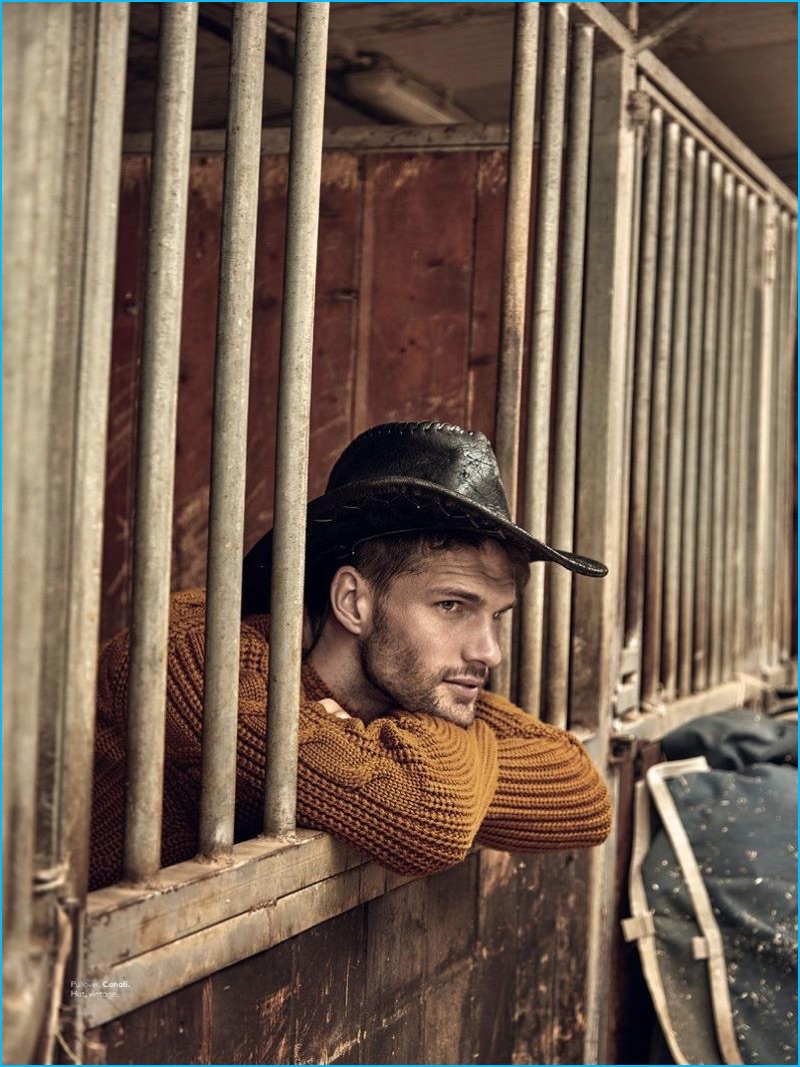 Model Tomas Skoloudik sports a mustard yellow sweater from Canali for L'Officiel Hommes Switzerland.