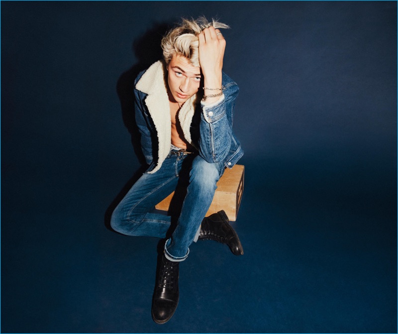 Wearing distressed denim, Lucky Blue Smith fronts Tommy Hilfiger's fall-winter 2016 campaign for Tommy Jeans.