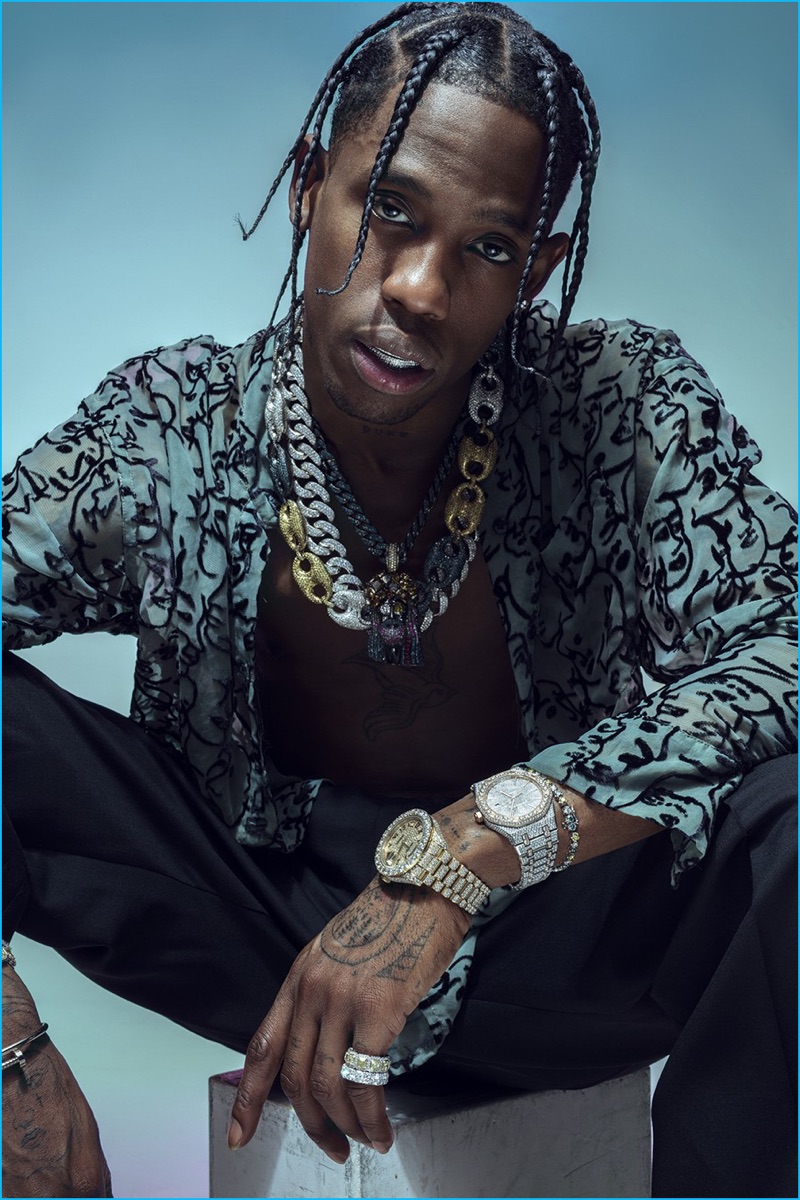 Appearing in a feature for Paper magazine, Travis Scott wears an Eckhaus Latta shirt with Givenchy trousers.