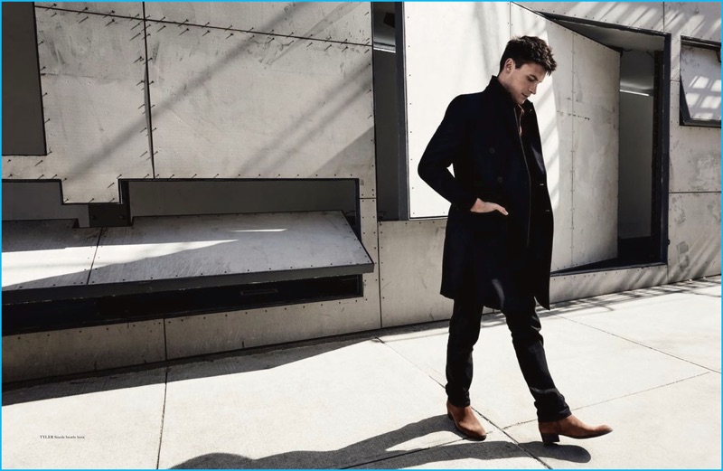 Taking a stroll, Miles Garber rocks a pair of ankle boots from Vagabond.