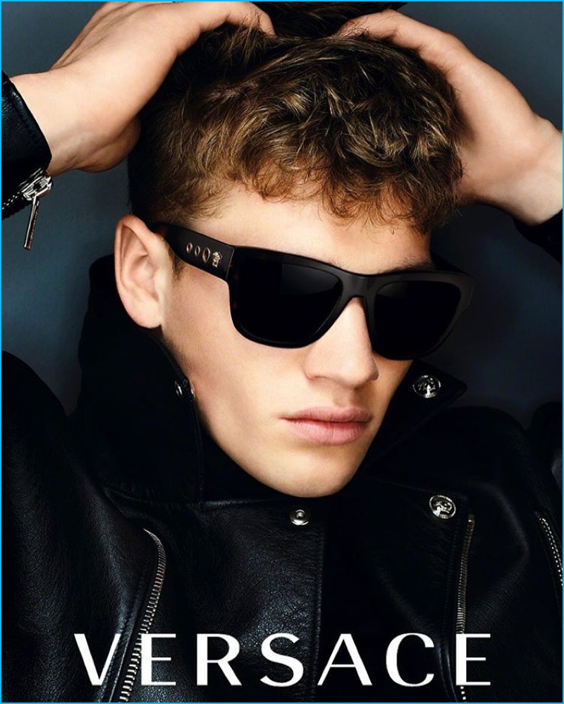 Matty Carrington wears Versace's square sunglasses with a side detail for the brand's fall-winter 2016 campaign.