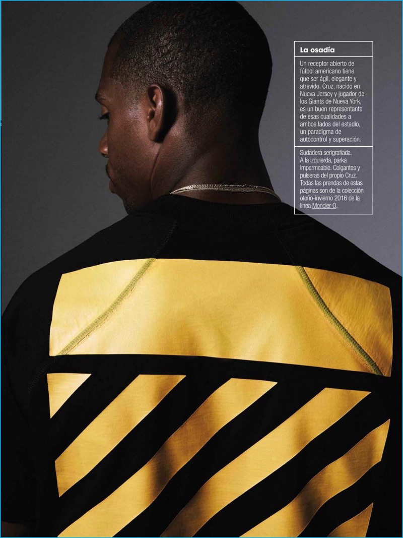 Victor Cruz showcases the back of a Moncler O design, which references Off-White's signature diagonal motif.