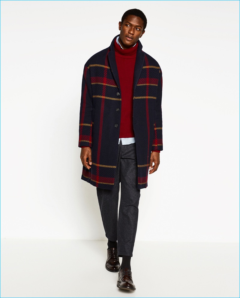 Hamid Onifade dons a plaid cashmere wool coat from Zara Man's College League collection.