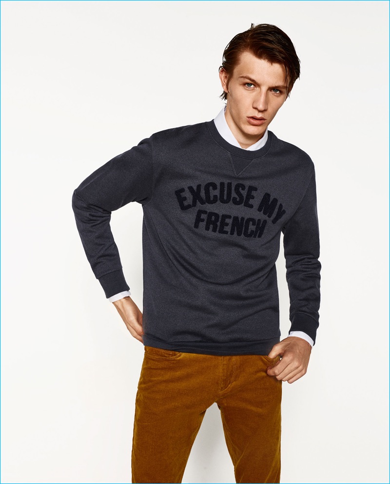 Model Finnlay Davis wears a cheeky Excuse My French sweatshirt from Zara Man's College League collection.