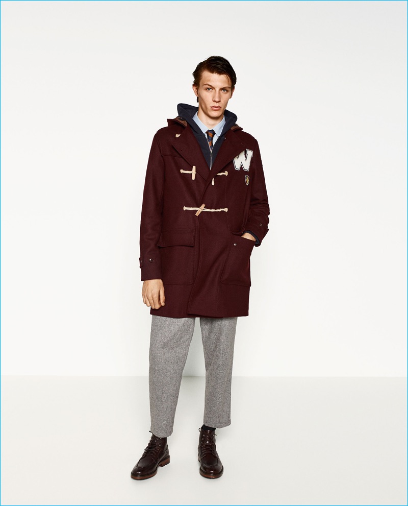 Ready for cold weather, Finnlay Davis wears a patch duffle coat from Zara Man's College League collection.