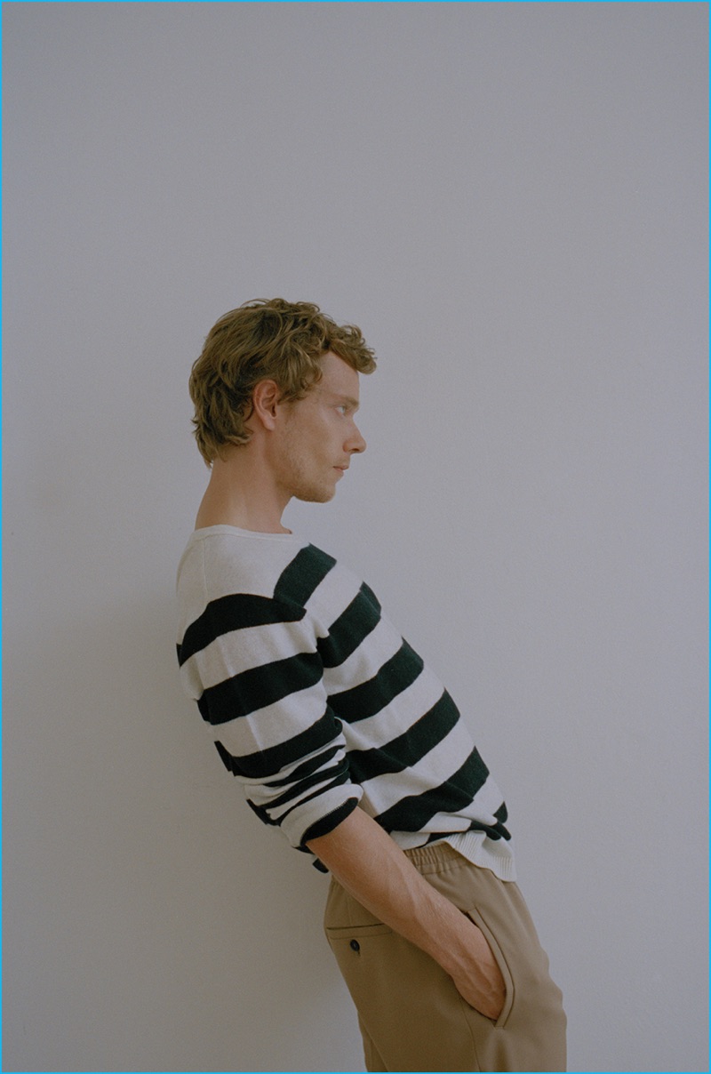 Appearing in a photo shoot for The Laterals, Alfie Allen wears a striped American Vintage sweater with Joseph track pants. 