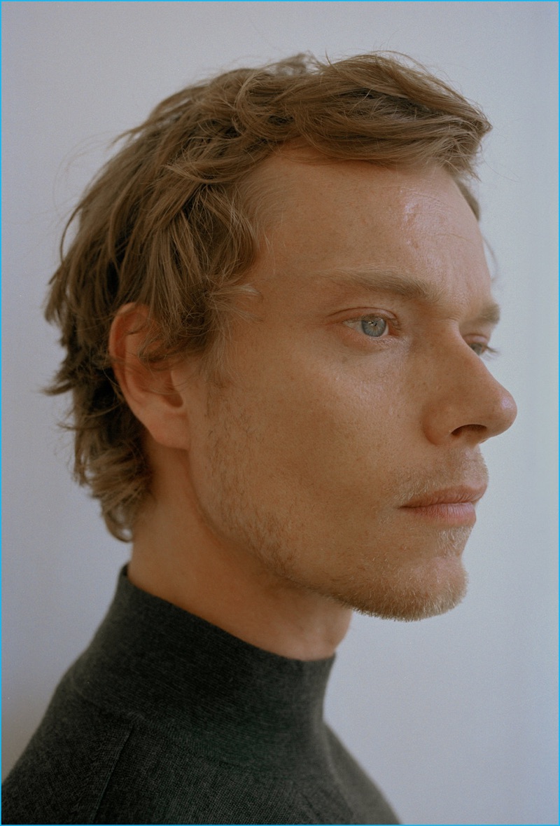 Delivering a profile, Alfie Allen sports a Nicole Farhi turtleneck sweater.