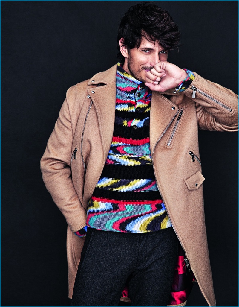 Spanish model Andres Velencoso dons a camel coat from Dior Homme with a Missoni sweater, and BOSS Hugo Boss trousers.