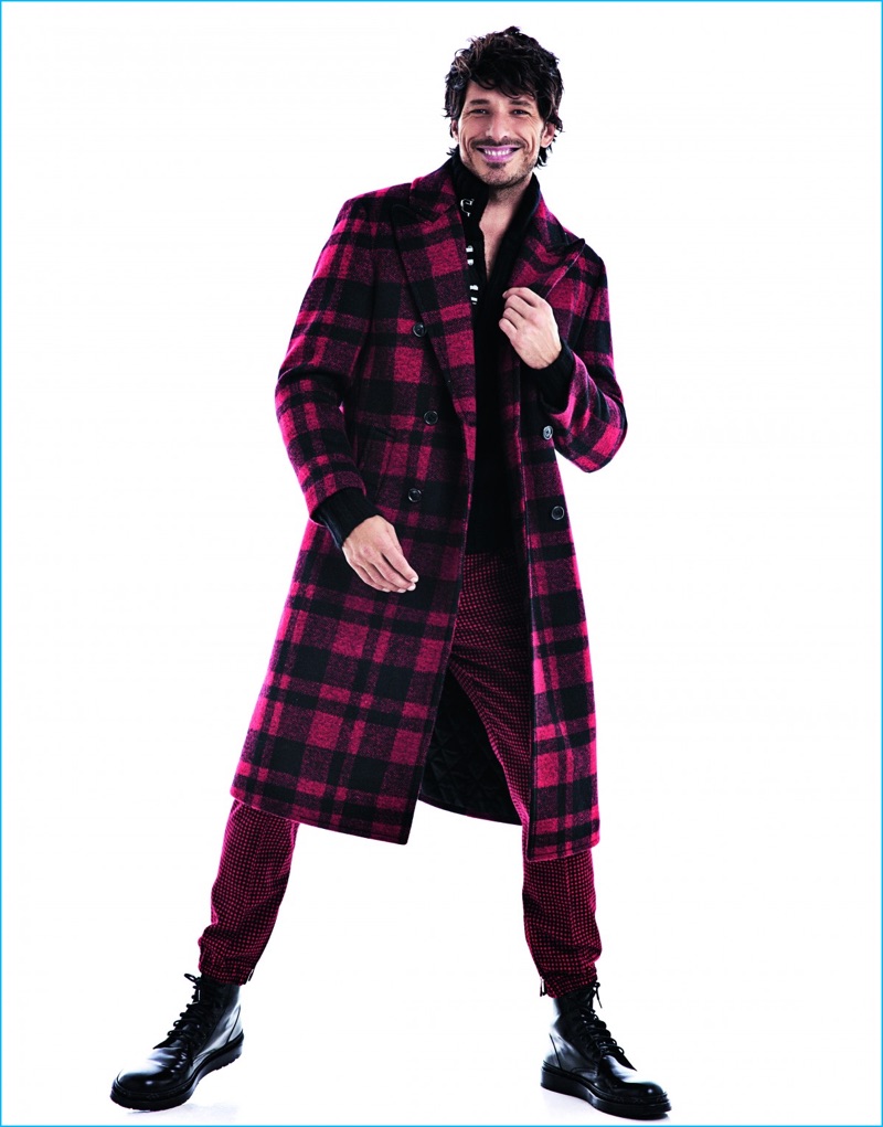 Richard Ramos photographs Andres Velencoso in a red and black buffalo check coat from Michael Kors. Andres also sports plaid trousers from Dior Homme with Louis Vuitton combat boots.