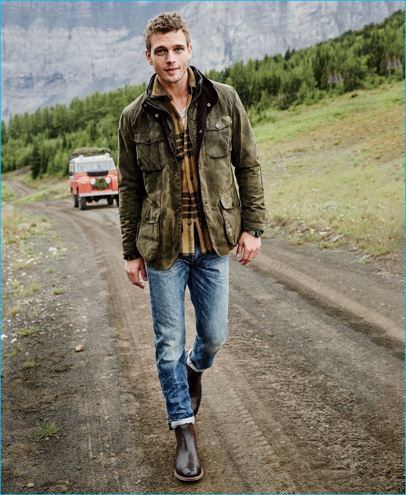 Benjamin Eidem rocks a Barbour Ogston jacket with a Wallace & Barnes flannel shirt. The Swedish model also wears a J.Crew garment-dyed t-shirt, 770 jeans, and Kenton leather Chelsea boots.