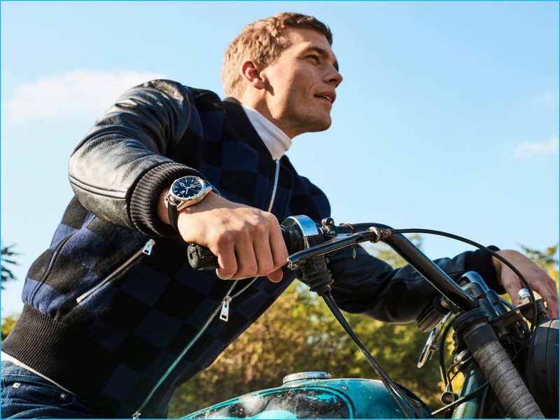 Swedish model Benjamin Eidem wears A.P.C. jeans with a Bally turtleneck, Ami bomber jacket, and a Tag Heuer watch.