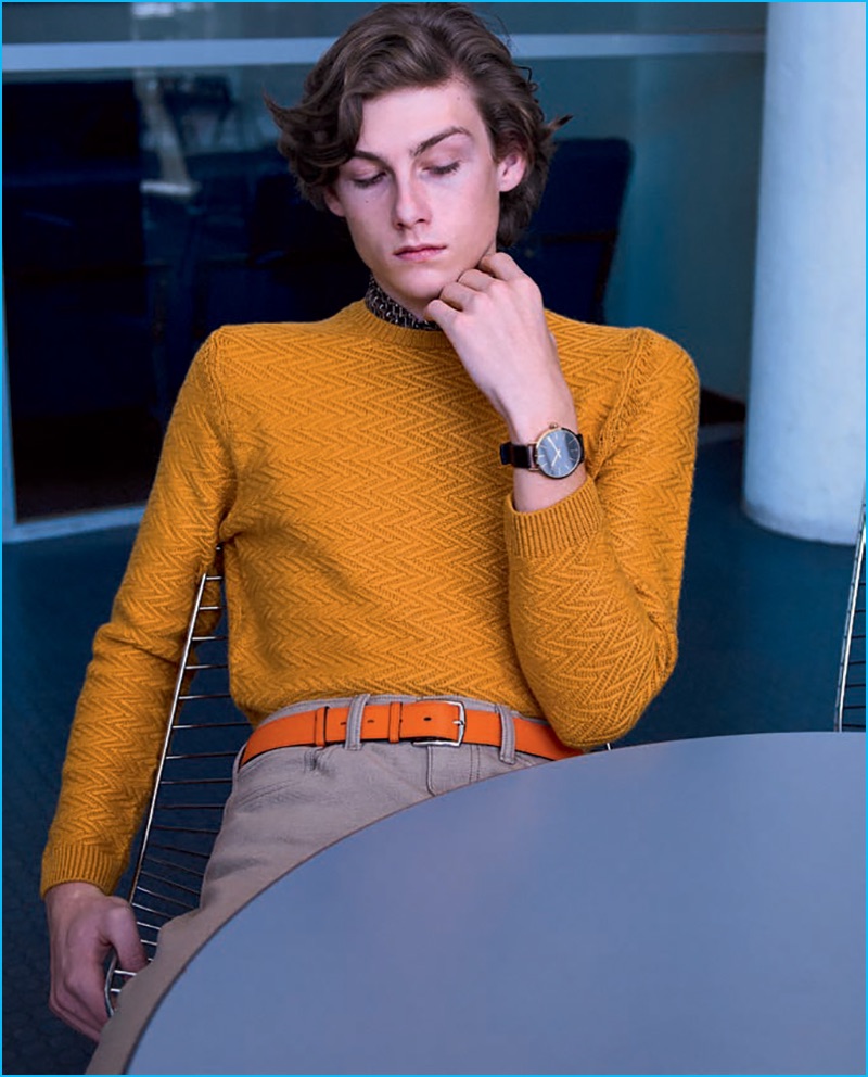 Front and center, Benjamin Vytiska wears a mustard yellow Mango sweater with Dockers trousers, a Hermes belt and Calvin Klein watch.