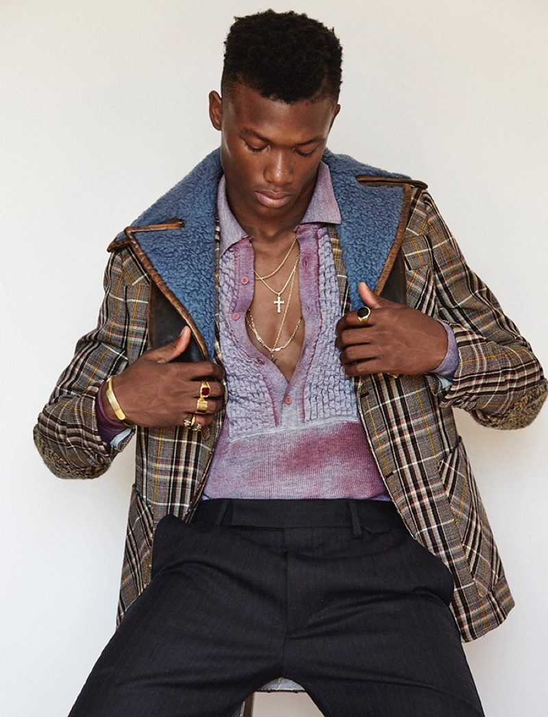 Model Brandon Harris wears a plaid jacket from Prada's fall-winter 2016 collection.