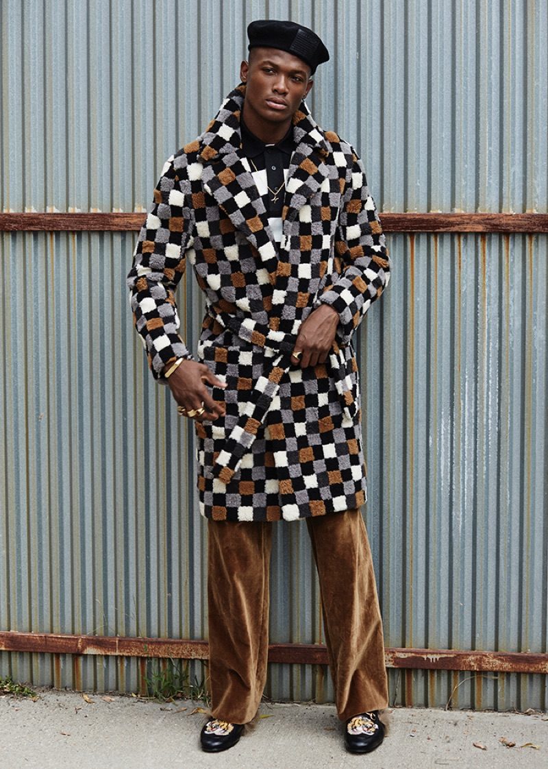 Making quite the statement, Brandon Harris wears a check look from Fendi.