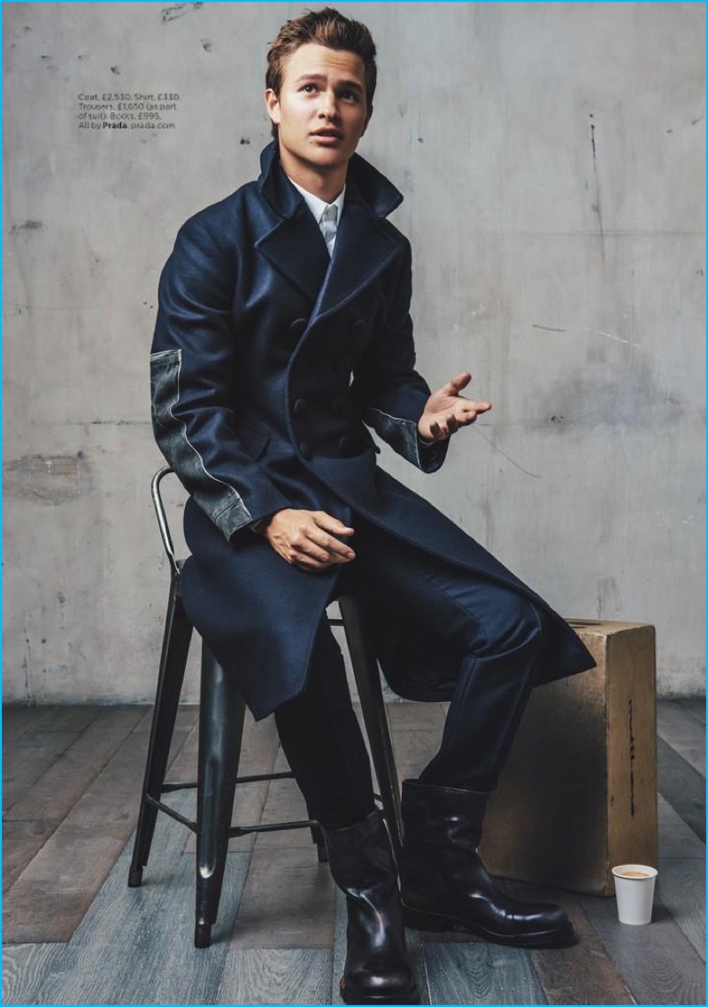 Actor Ansel Elgort dons a double-breasted coat with a smart shirt and trousers from Prada.